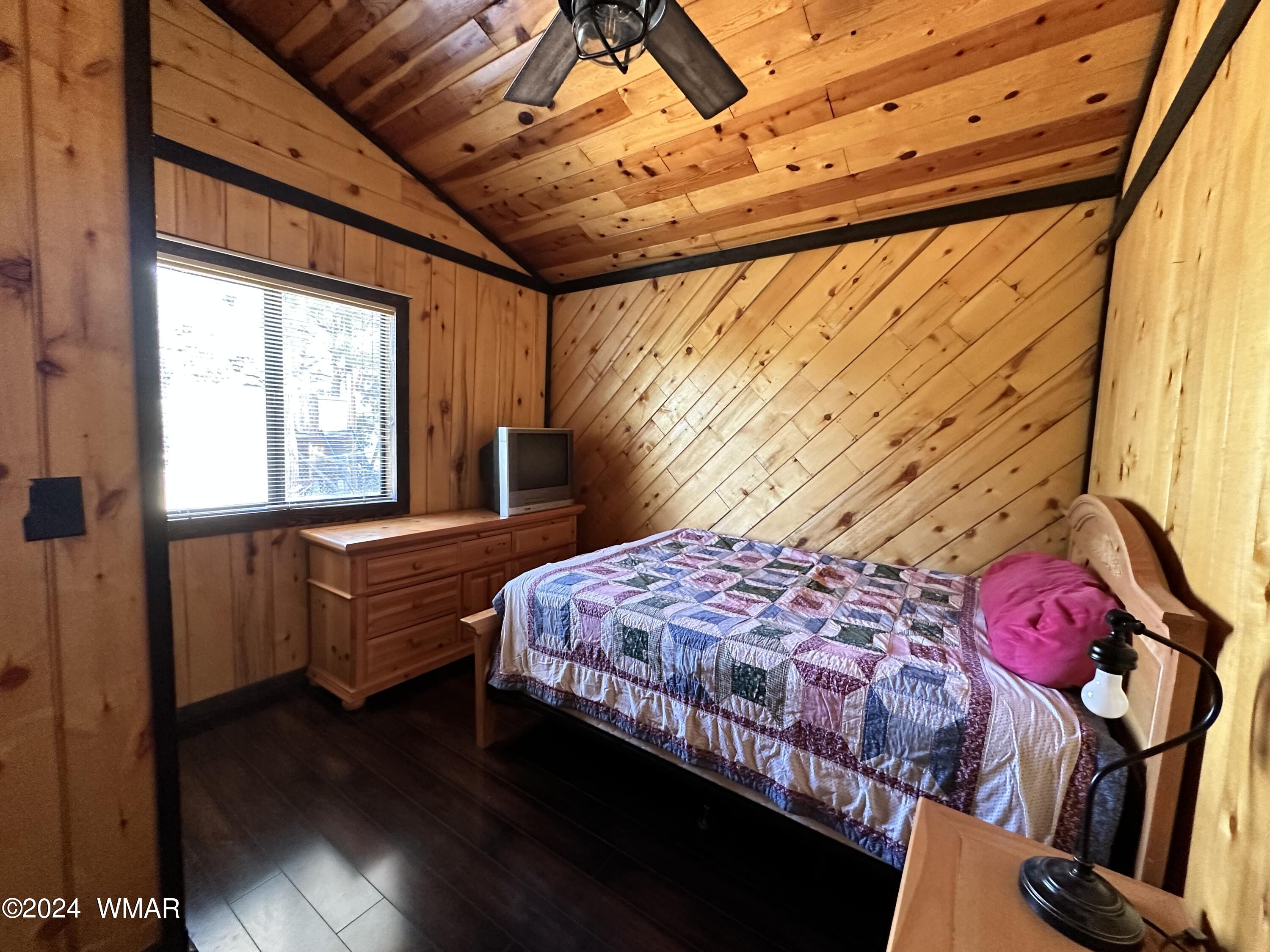 3403 Top View Road Overgaard, AZ 85933 - Photo 10 of 19 a bedroom with bed and a window