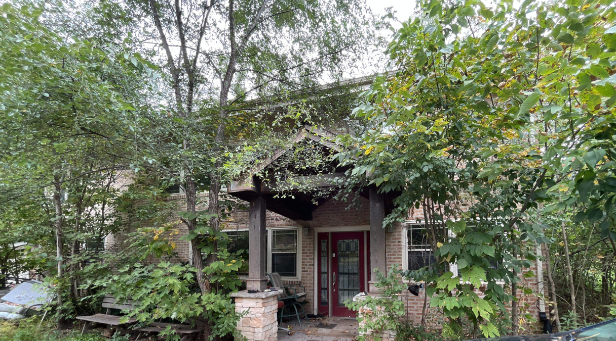 11930 Walker Road Lemont, IL 60439 - Photo 1 of 2 a front view of a house with plants and trees