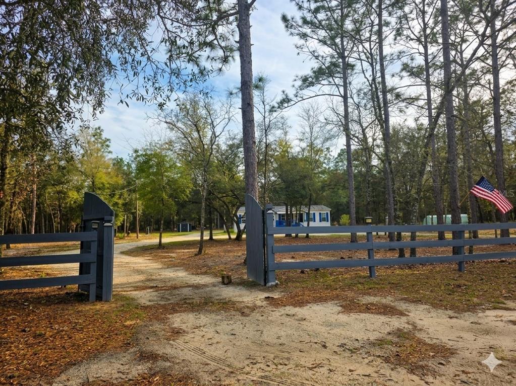 10630 Northeast 80th Street Bronson, FL 32621 - Photo 2 of 19 a view of a park with swings
