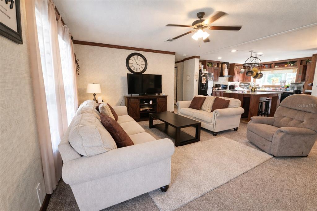 10630 Northeast 80th Street Bronson, FL 32621 - Photo 6 of 19 a living room with furniture and a large window