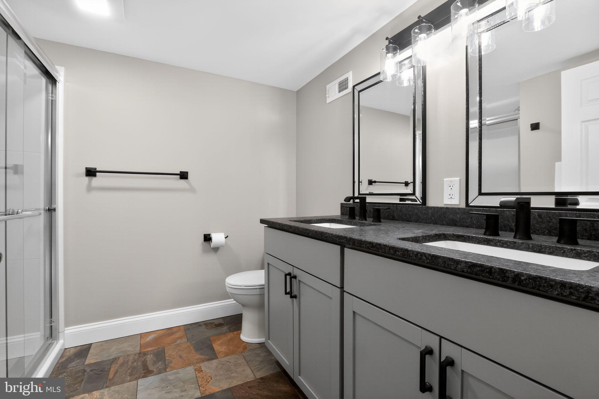 128 Maugers Mill Road Pottstown, PA 19464 - Photo 21 of 42 Sleek modern bathroom with dual sinks.