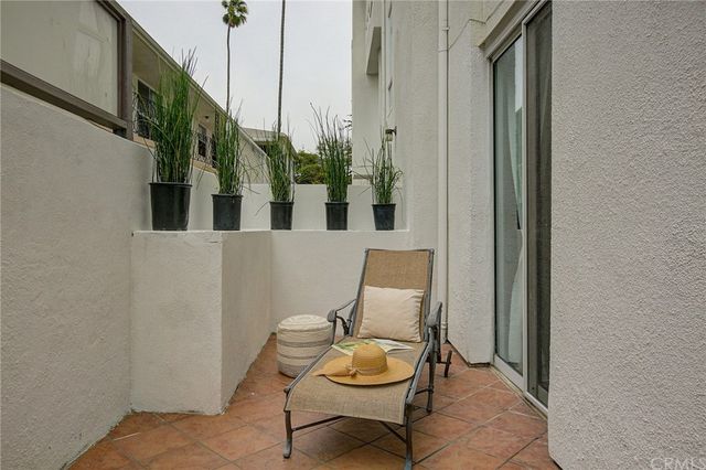 a view of a hallway with seating area