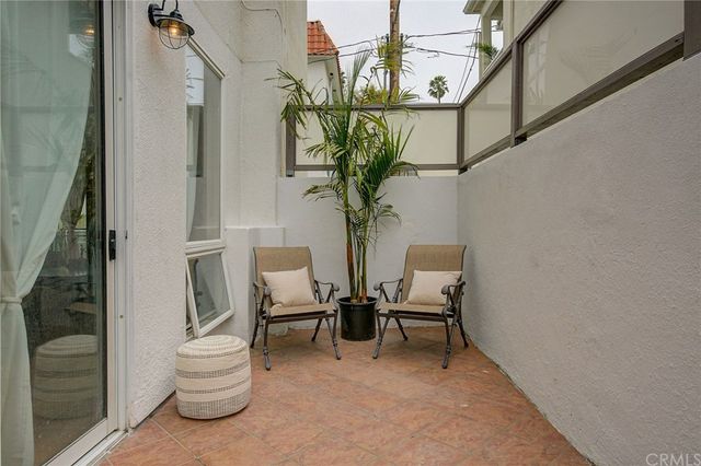 a view of hall way with furniture