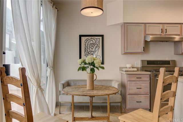 a view of kitchen with cabinets and outdoor seating