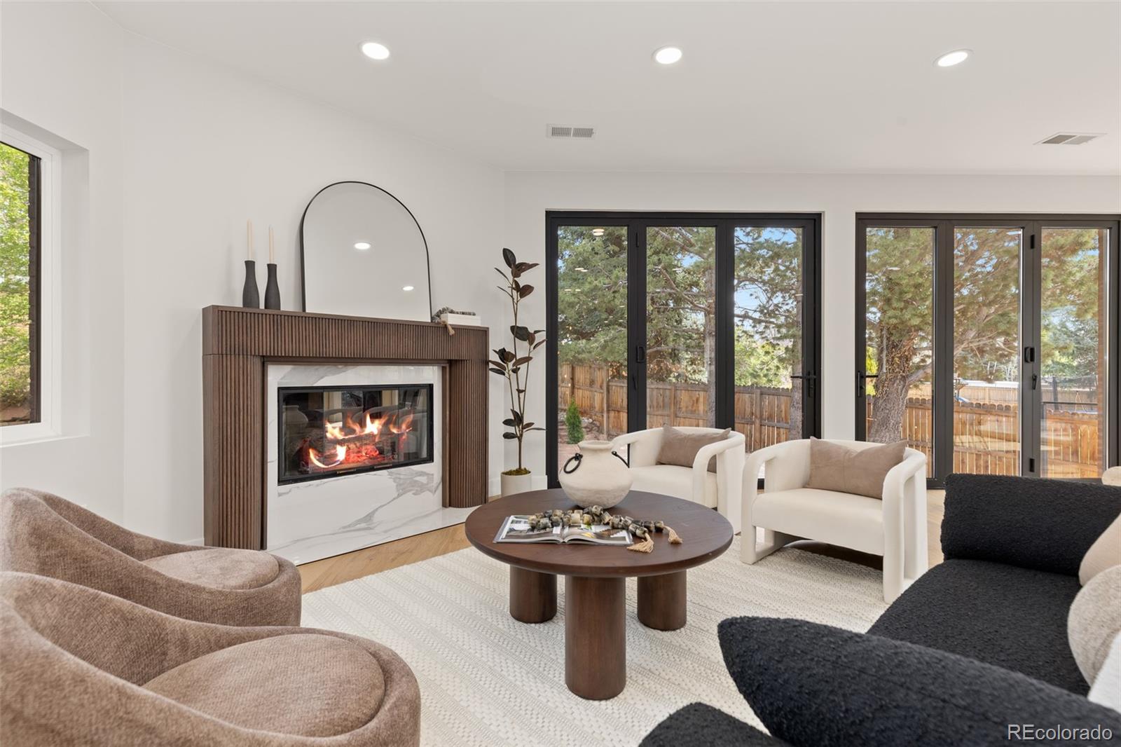 11895 West 35th Avenue Wheat Ridge, CO 80033 - Photo 12 of 50 a living room with furniture and a fireplace