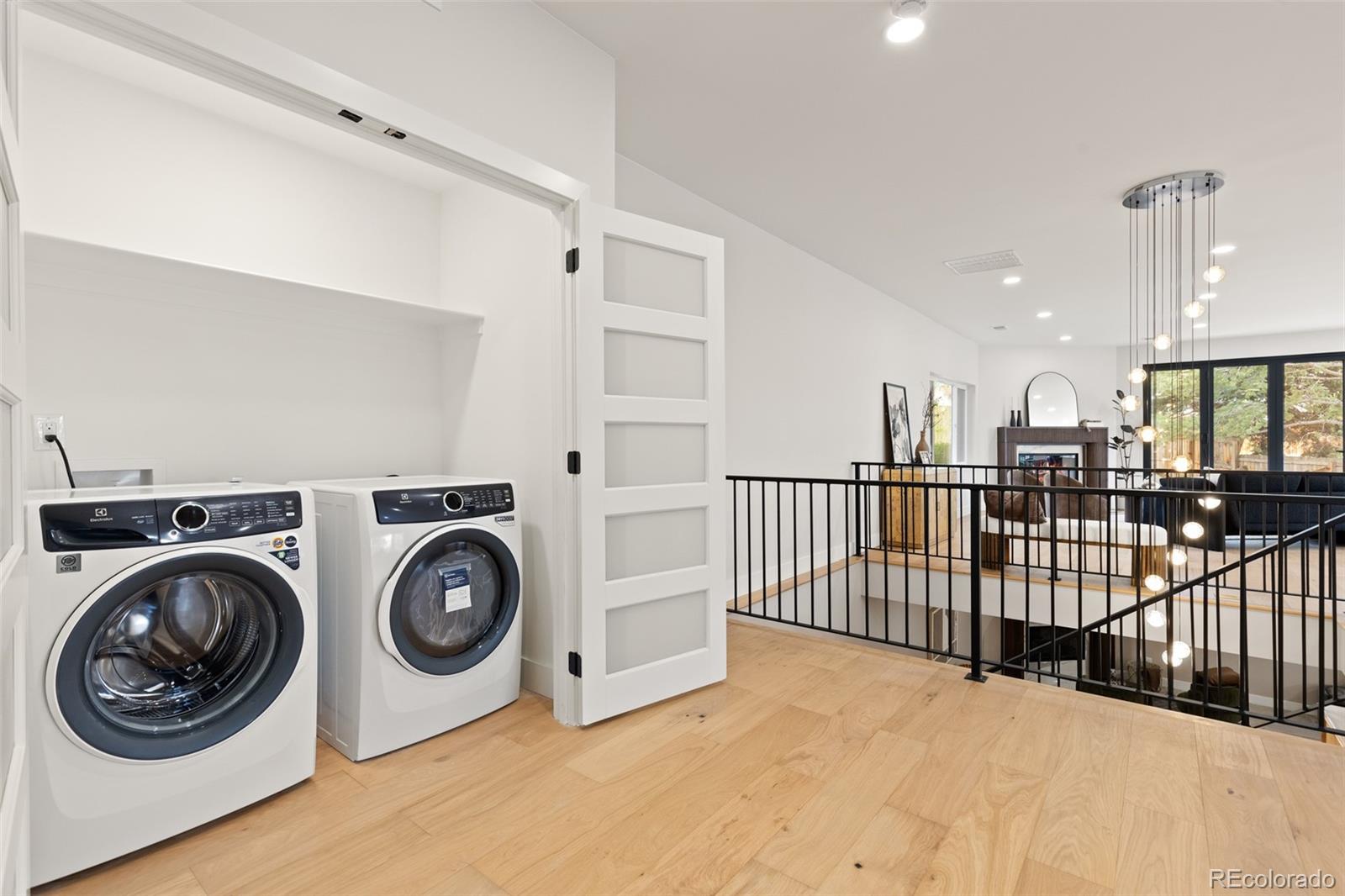 11895 West 35th Avenue Wheat Ridge, CO 80033 - Photo 19 of 50 a view of a hallway with washer and dryer