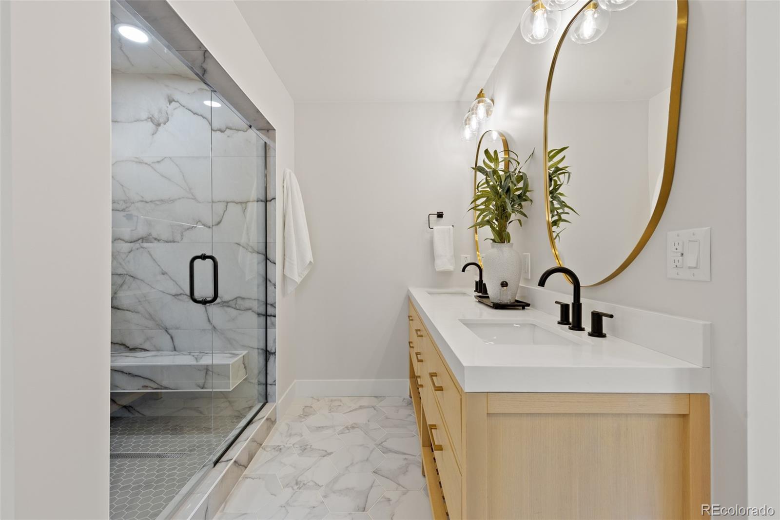 11895 West 35th Avenue Wheat Ridge, CO 80033 - Photo 23 of 50 a bathroom with a sink and mirror