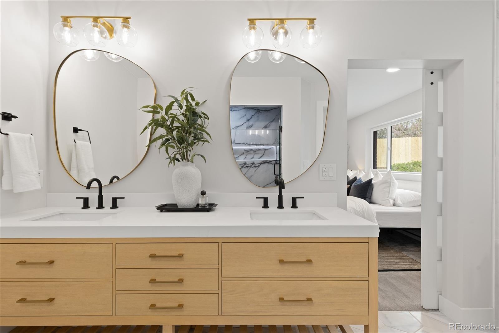 11895 West 35th Avenue Wheat Ridge, CO 80033 - Photo 25 of 50 a bathroom with sinks and mirror