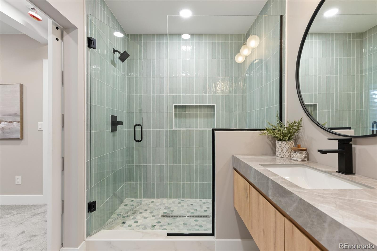 11895 West 35th Avenue Wheat Ridge, CO 80033 - Photo 40 of 50 a bathroom with a sink and a mirror