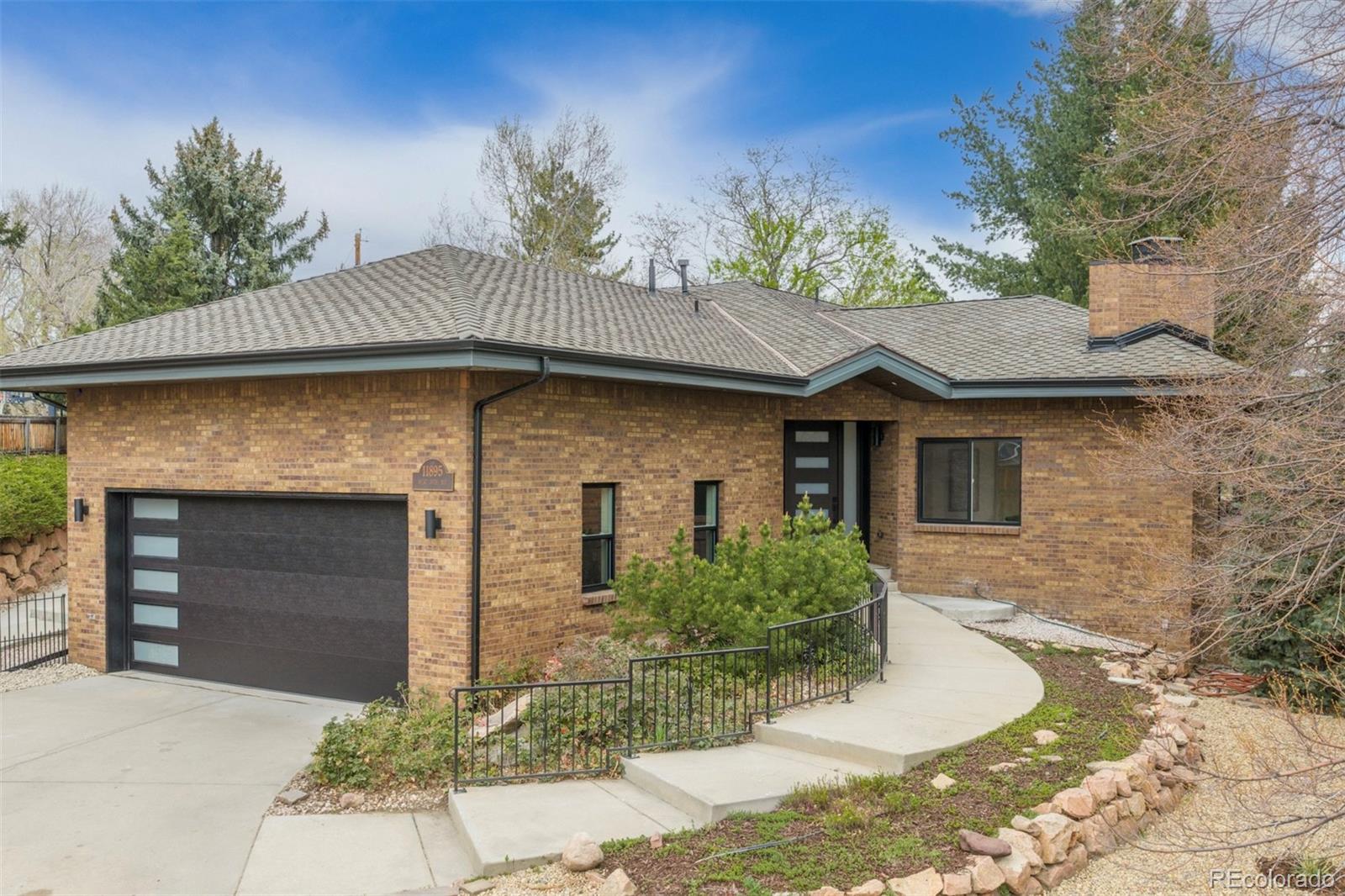 11895 West 35th Avenue Wheat Ridge, CO 80033 - Photo 47 of 50 a front view of a house with a yard
