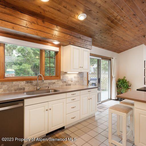 515 Park Circle Basalt, CO 81621 - Photo 8 of 25 a kitchen with granite countertop white cabinets and a large window