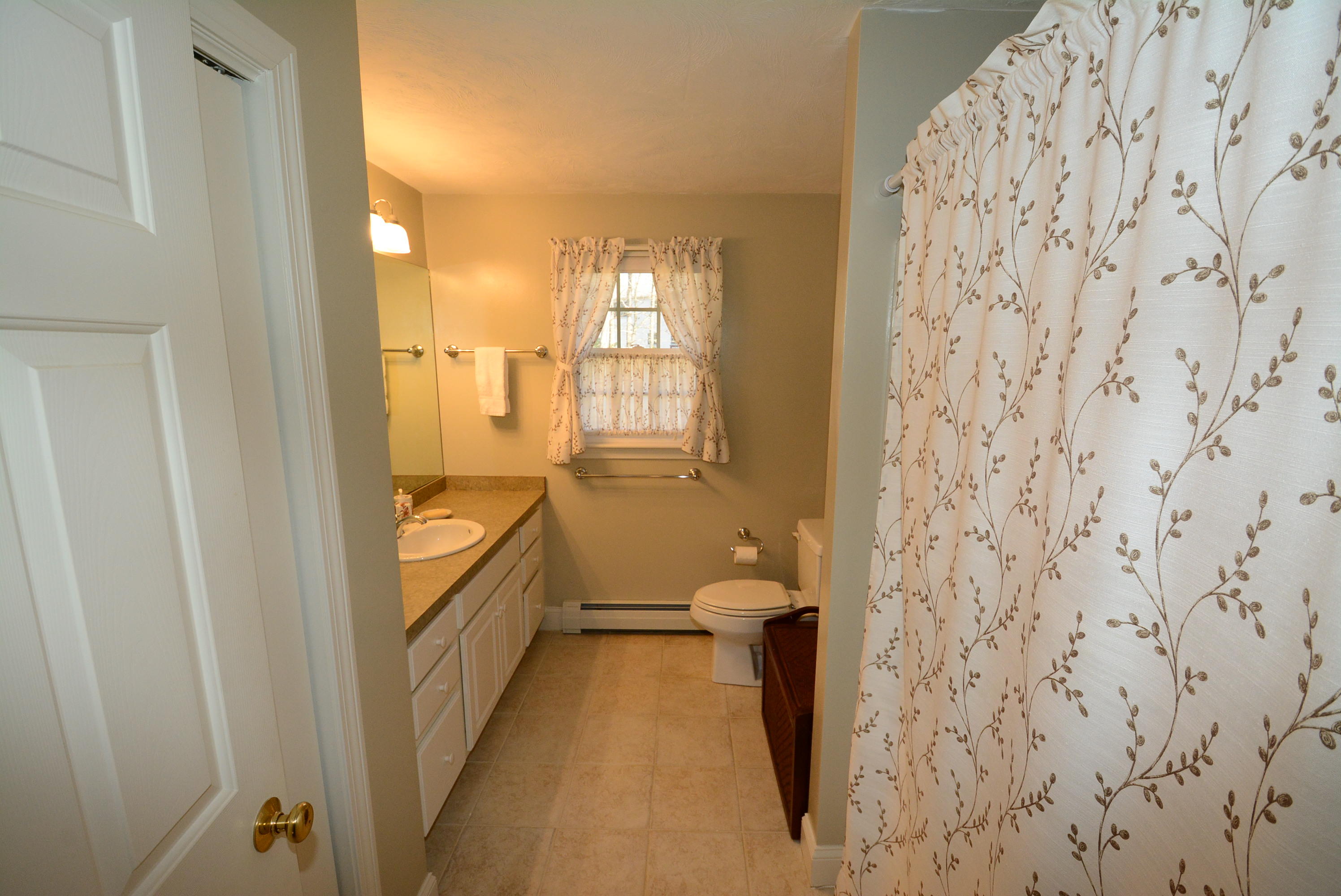 2 Tiffany Road Monument Beach, MA 02532 - Photo 26 of 35 a bathroom with a granite countertop sink and a mirror