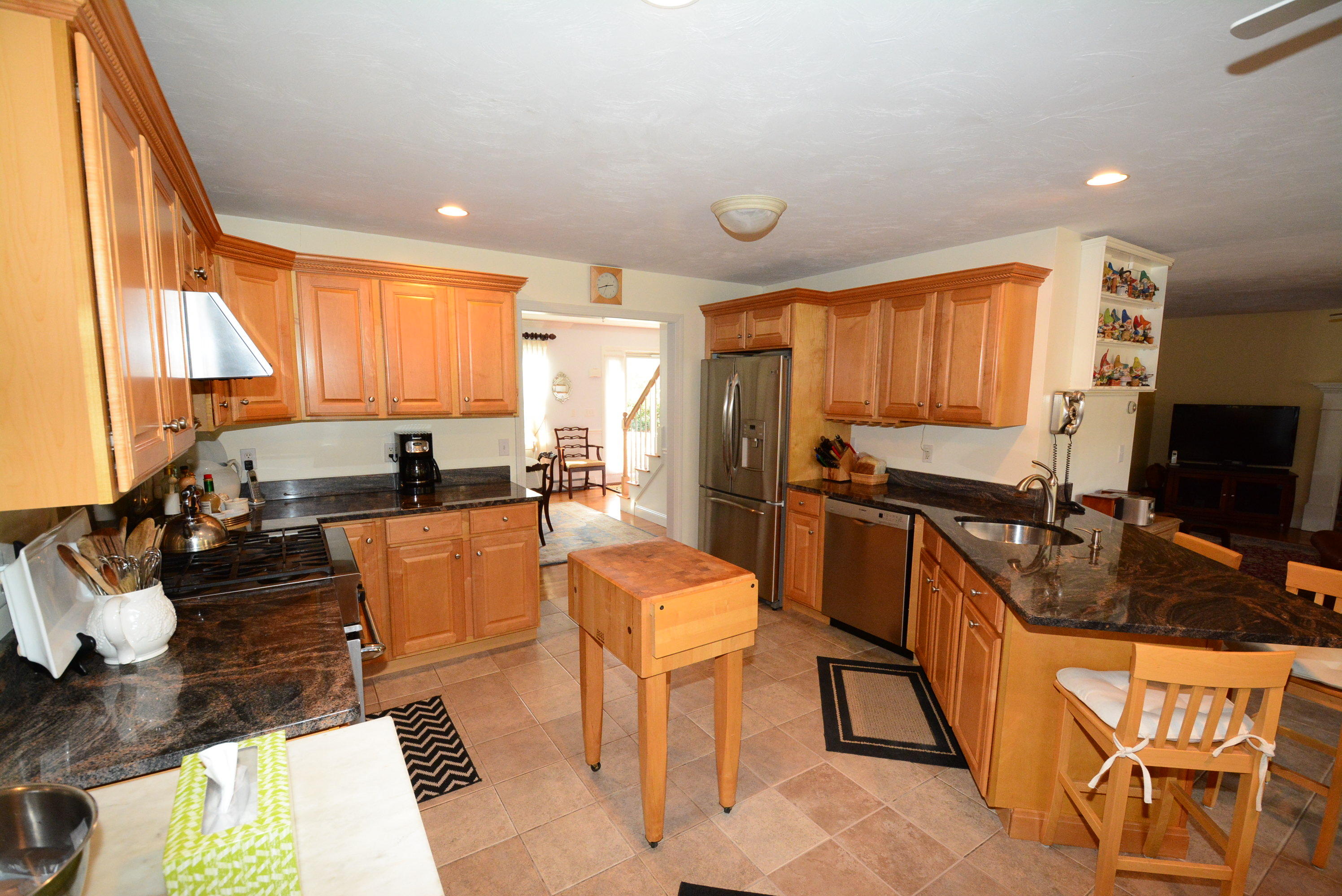 2 Tiffany Road Monument Beach, MA 02532 - Photo 9 of 35 a large kitchen with a large window and stainless steel appliances