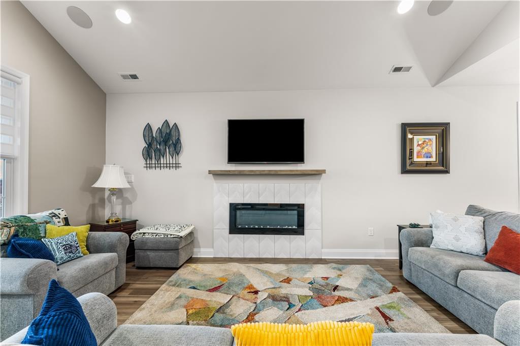 317 Anthem Way Canonsburg, PA 15317 - Photo 9 of 50 a living room with furniture a fireplace and a flat screen tv