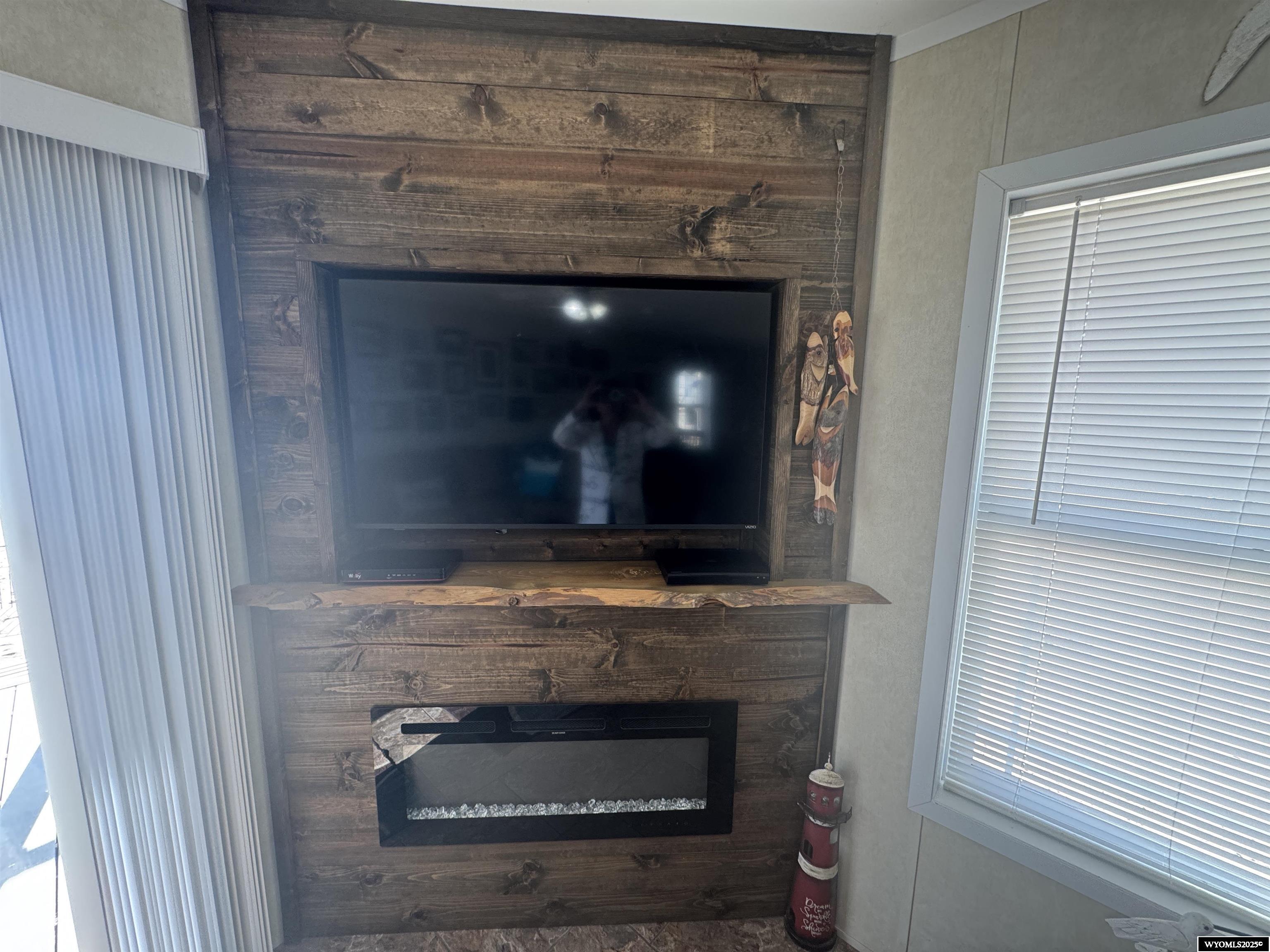 2469 C County Road 351 Sinclair, WY 82334 - Photo 10 of 32 Electric fire place is remote and changes colors for mood enhancing moments! 50" Smart TV included.