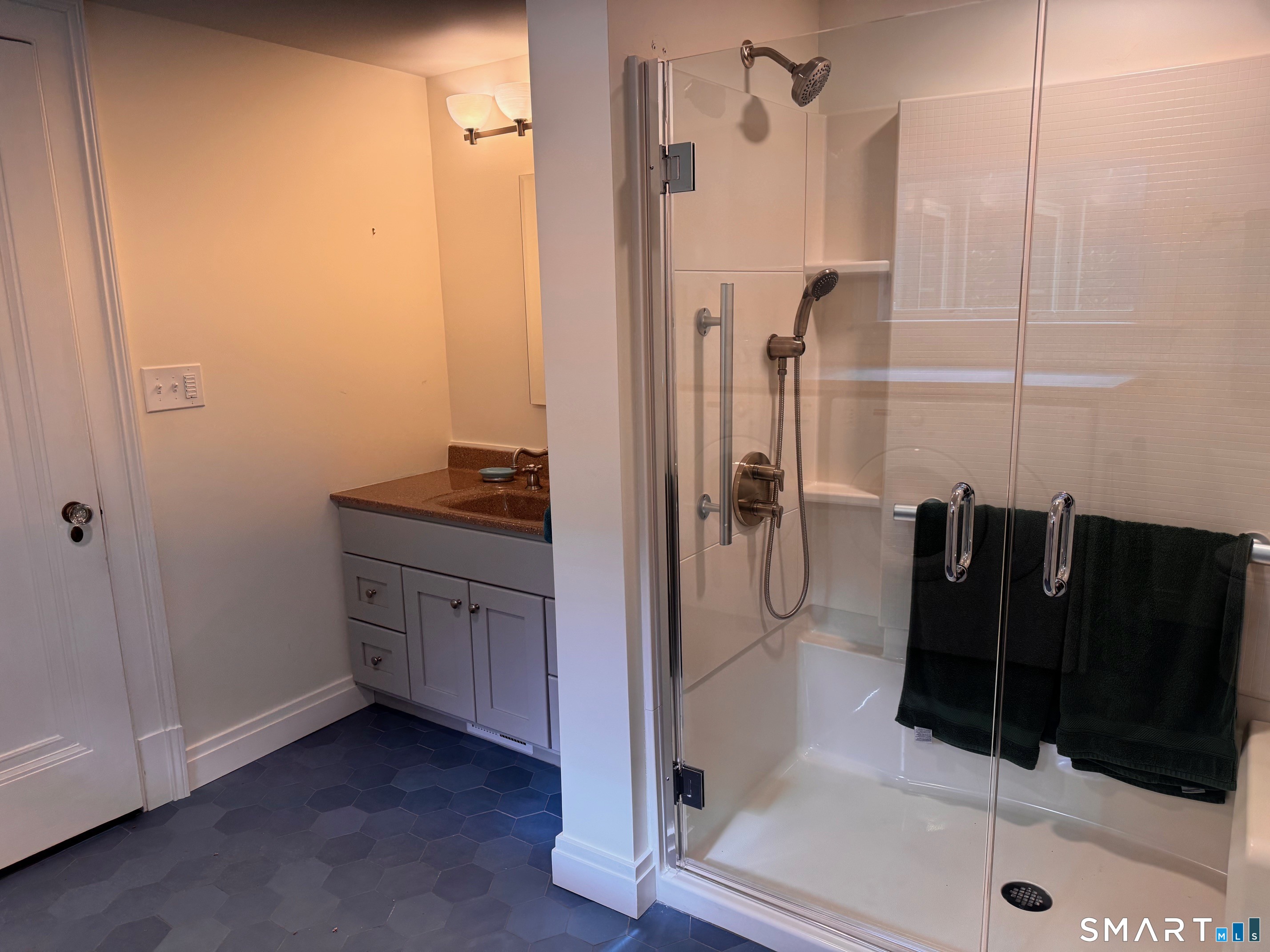 57 Mill Rock Road Hamden, CT 06517 - Photo 17 of 24 a bathroom with a shower and a sink