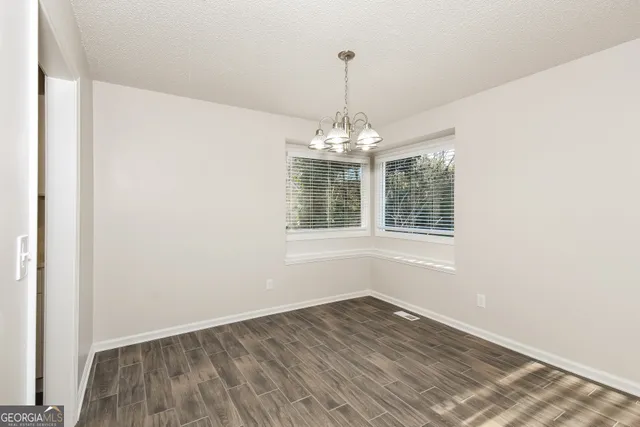 a view of a windows and chandelier in a room