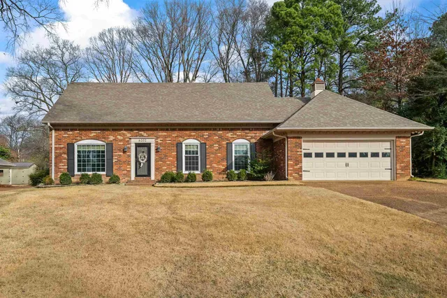 front view of a house with a yard