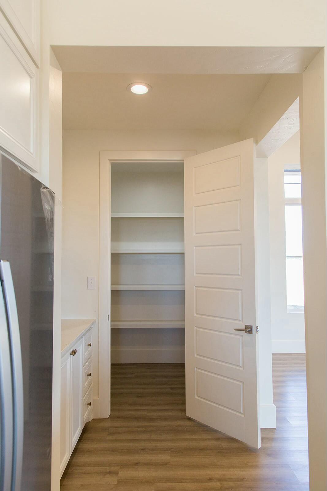 7211 West 12th Street Plainview, TX 79072 - Photo 19 of 48 a view of walk in closet with empty racks