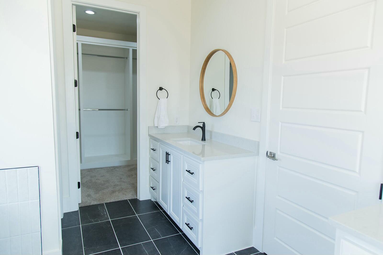 7211 West 12th Street Plainview, TX 79072 - Photo 31 of 48 a bathroom with a double vanity sink and a mirror