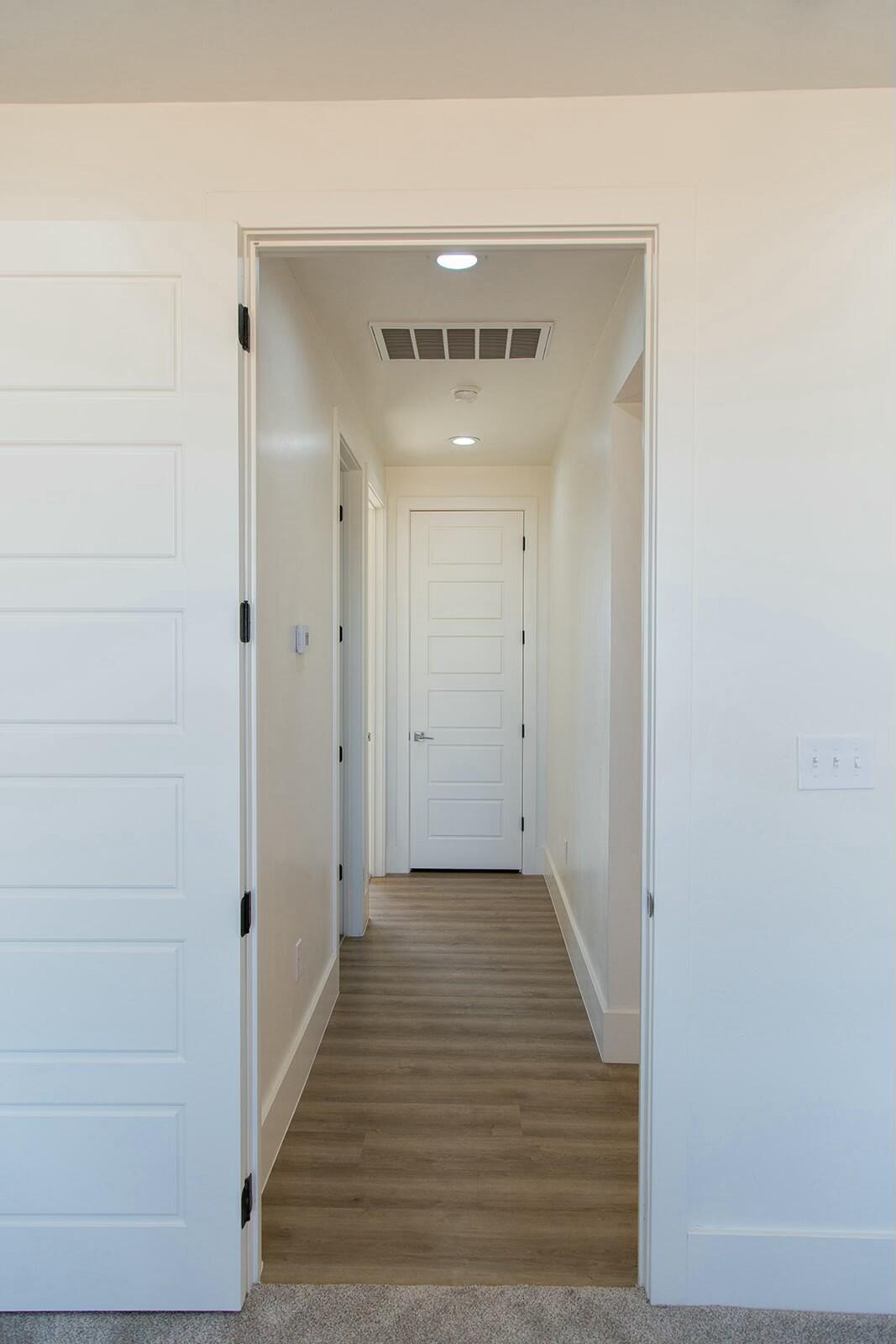 7211 West 12th Street Plainview, TX 79072 - Photo 34 of 48 a view of a hallway with wooden floor