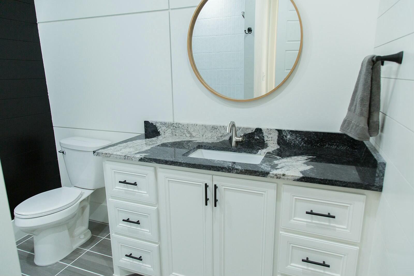 7211 West 12th Street Plainview, TX 79072 - Photo 37 of 48 a bathroom with a sink and a mirror