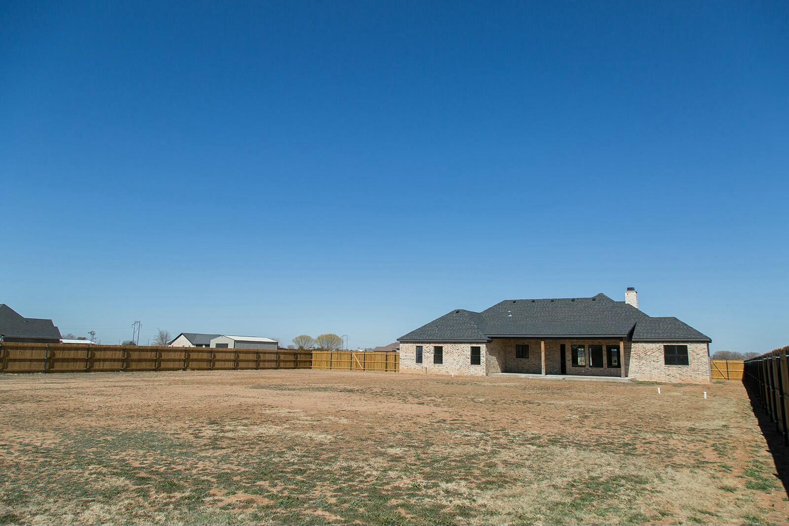 7211 West 12th Street Plainview, TX 79072 - Photo 45 of 48 a front view of a house with a yard