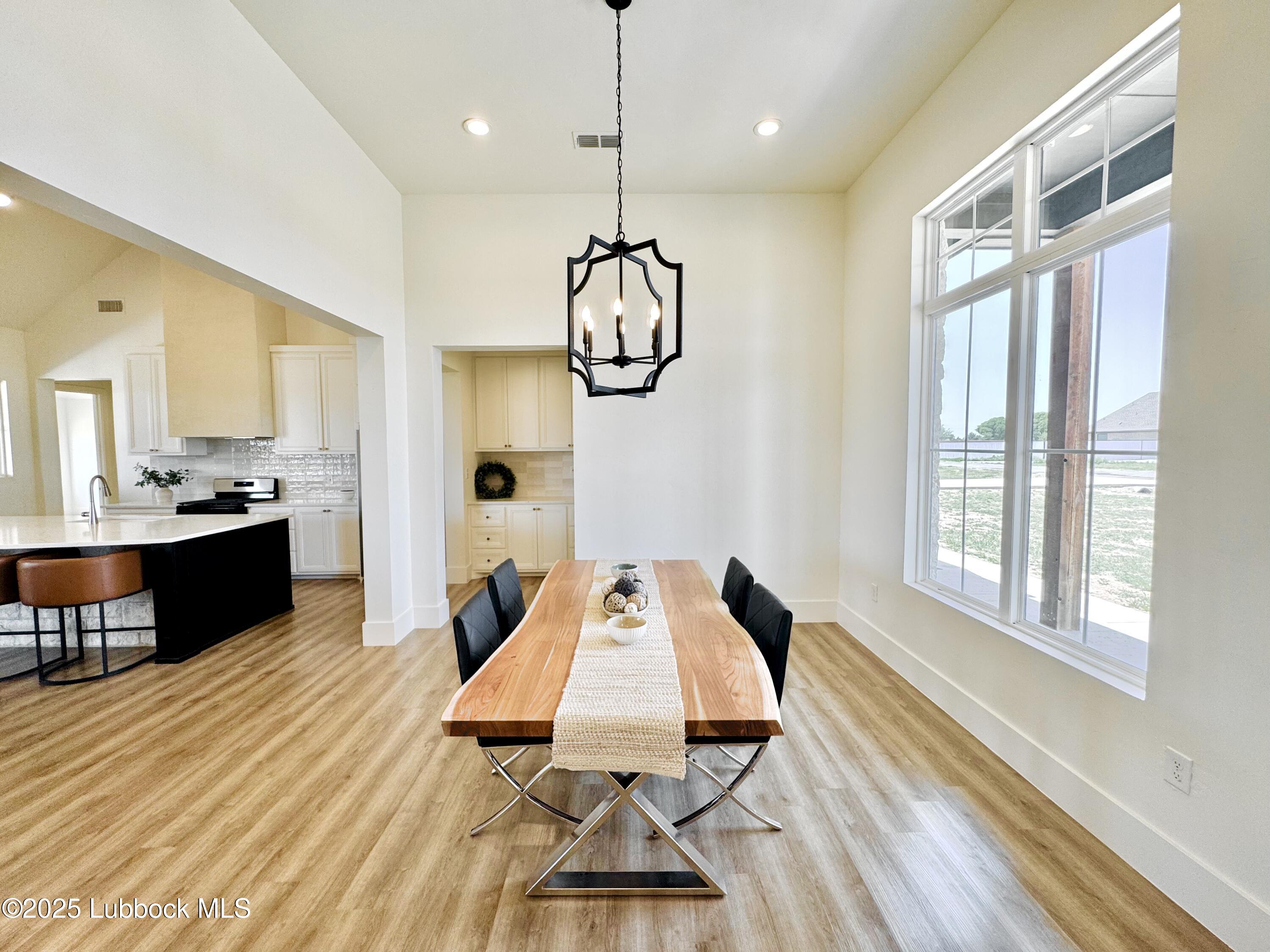 7211 West 12th Street Plainview, TX 79072 - Photo 7 of 48 a very nice looking dining room with a table and chairs