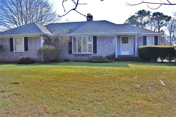 445 Falmouth Road Barnstable, MA 02601 - Photo 1 of 29 a front view of a house with a garden
