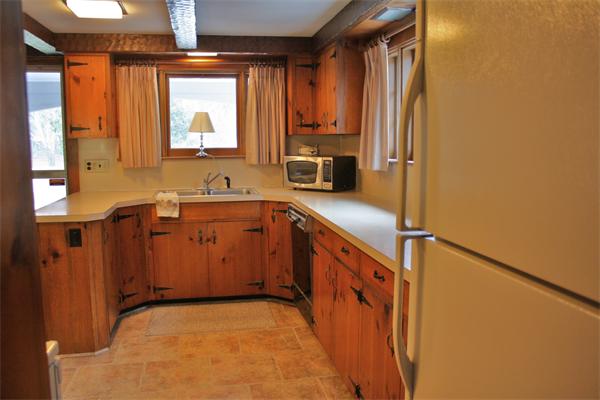 445 Falmouth Road Barnstable, MA 02601 - Photo 11 of 29 a kitchen with stainless steel appliances a sink stove and refrigerator