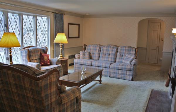 445 Falmouth Road Barnstable, MA 02601 - Photo 13 of 29 a living room with furniture a lamp and a window