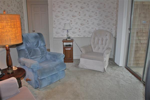 445 Falmouth Road Barnstable, MA 02601 - Photo 16 of 29 a living room with furniture and a fireplace