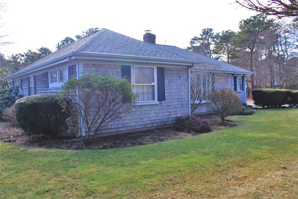 445 Falmouth Road Barnstable, MA 02601 - Photo 2 of 29 a view of a house with a yard and a large tree