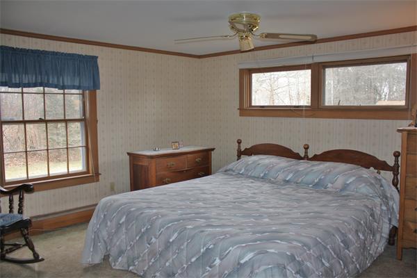 445 Falmouth Road Barnstable, MA 02601 - Photo 22 of 29 a bedroom with a bed and a window