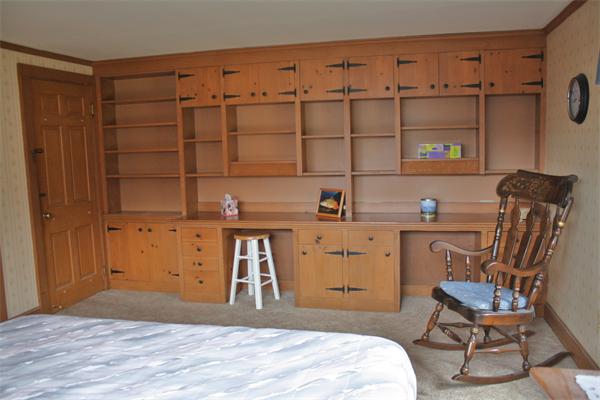 445 Falmouth Road Barnstable, MA 02601 - Photo 23 of 29 a bedroom with a bed and a chair