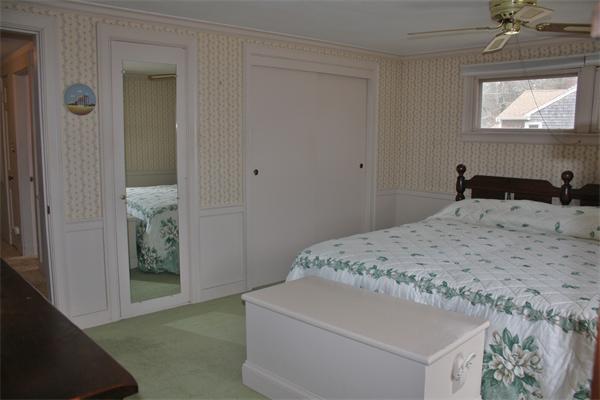 445 Falmouth Road Barnstable, MA 02601 - Photo 26 of 29 a bedroom with a bed and a window