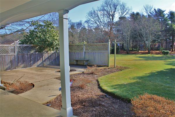 445 Falmouth Road Barnstable, MA 02601 - Photo 5 of 29 a view of a backyard with large tree