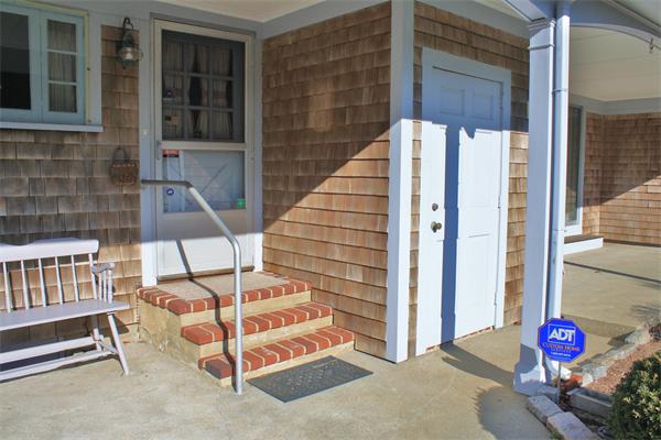 445 Falmouth Road Barnstable, MA 02601 - Photo 7 of 29 a view of entryway with wooden door and outdoor space