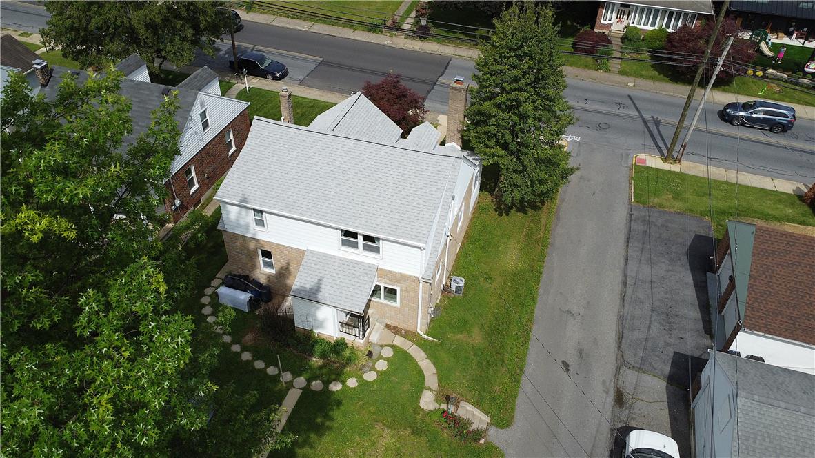 172 Harrison Street Emmaus, PA 18049 - Photo 21 of 30 An aerial perspective reveals a residence nestled among mature trees and neighborhood streets.