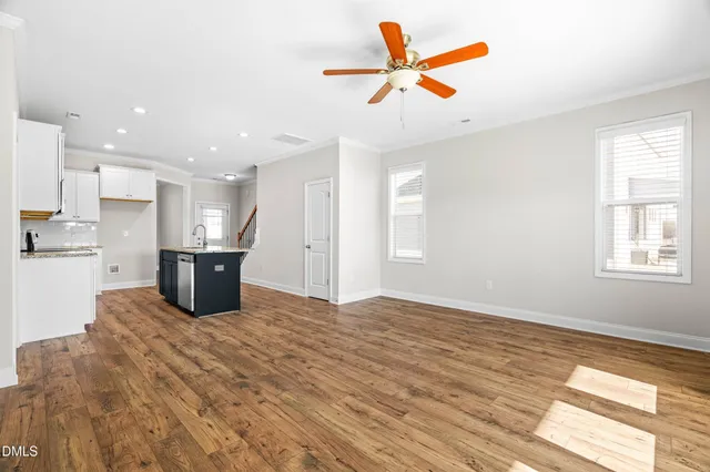 a view of kitchen with wooden floor and window