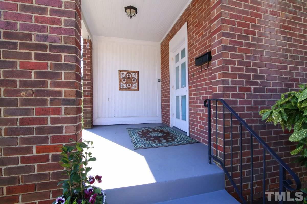 1011 Peace Street Raleigh, NC 27605 - Photo 2 of 25 a brick building with a black and white checkered floor