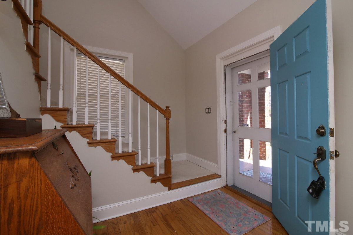 1011 Peace Street Raleigh, NC 27605 - Photo 3 of 25 a view of a hallway with wooden floor and staircase