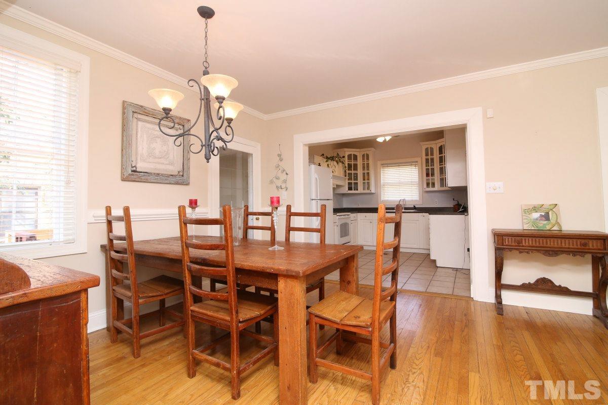 1011 Peace Street Raleigh, NC 27605 - Photo 8 of 25 a view of a dining room with furniture and wooden floor
