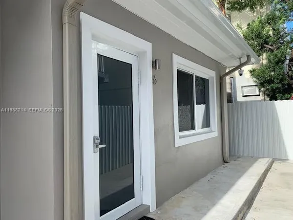 a view of a house with a wooden door