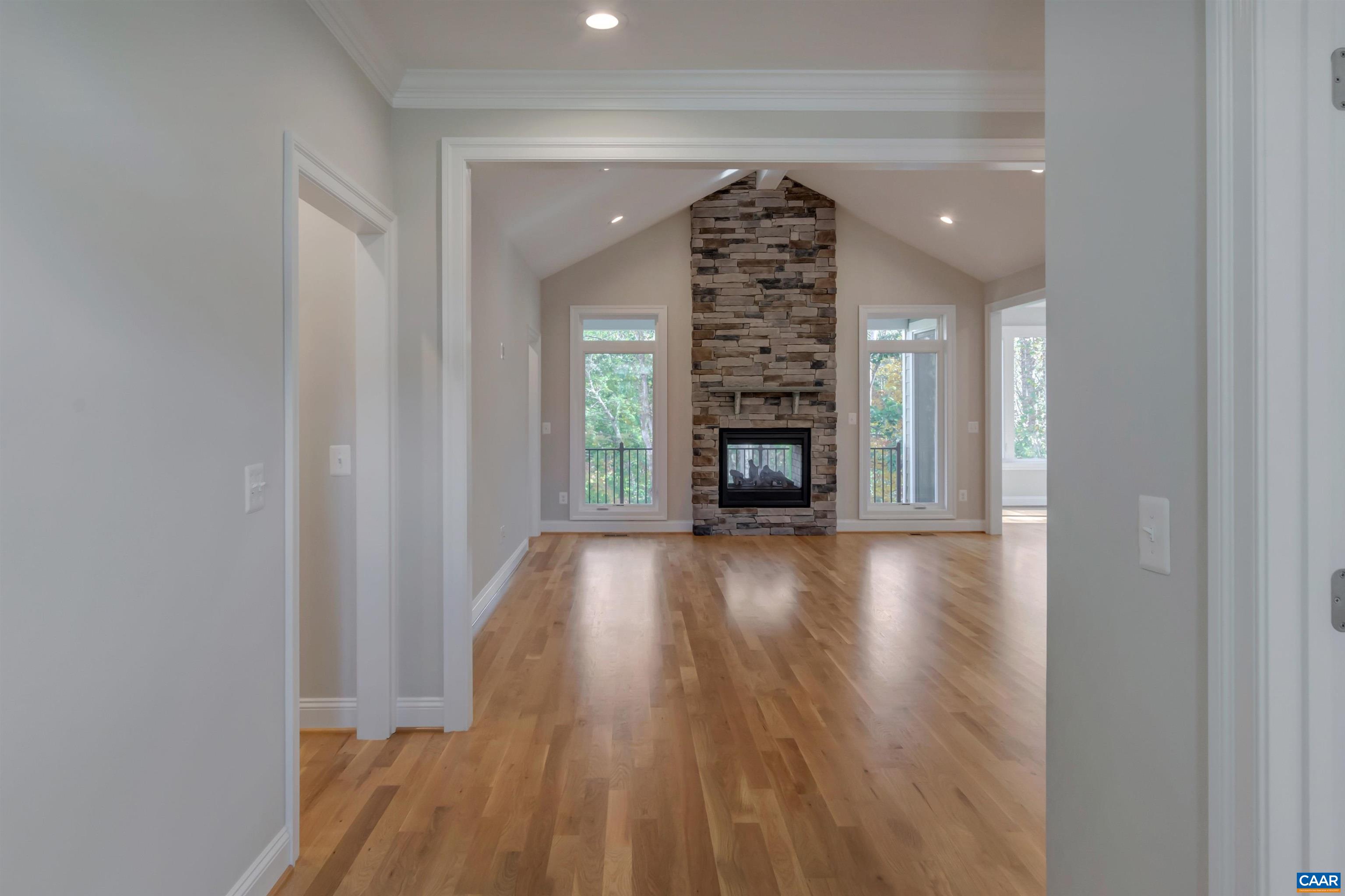 2519 Huntington Road Charlottesville, VA 22901 - Photo 12 of 47 a view of empty room with a fireplace and wooden floor
