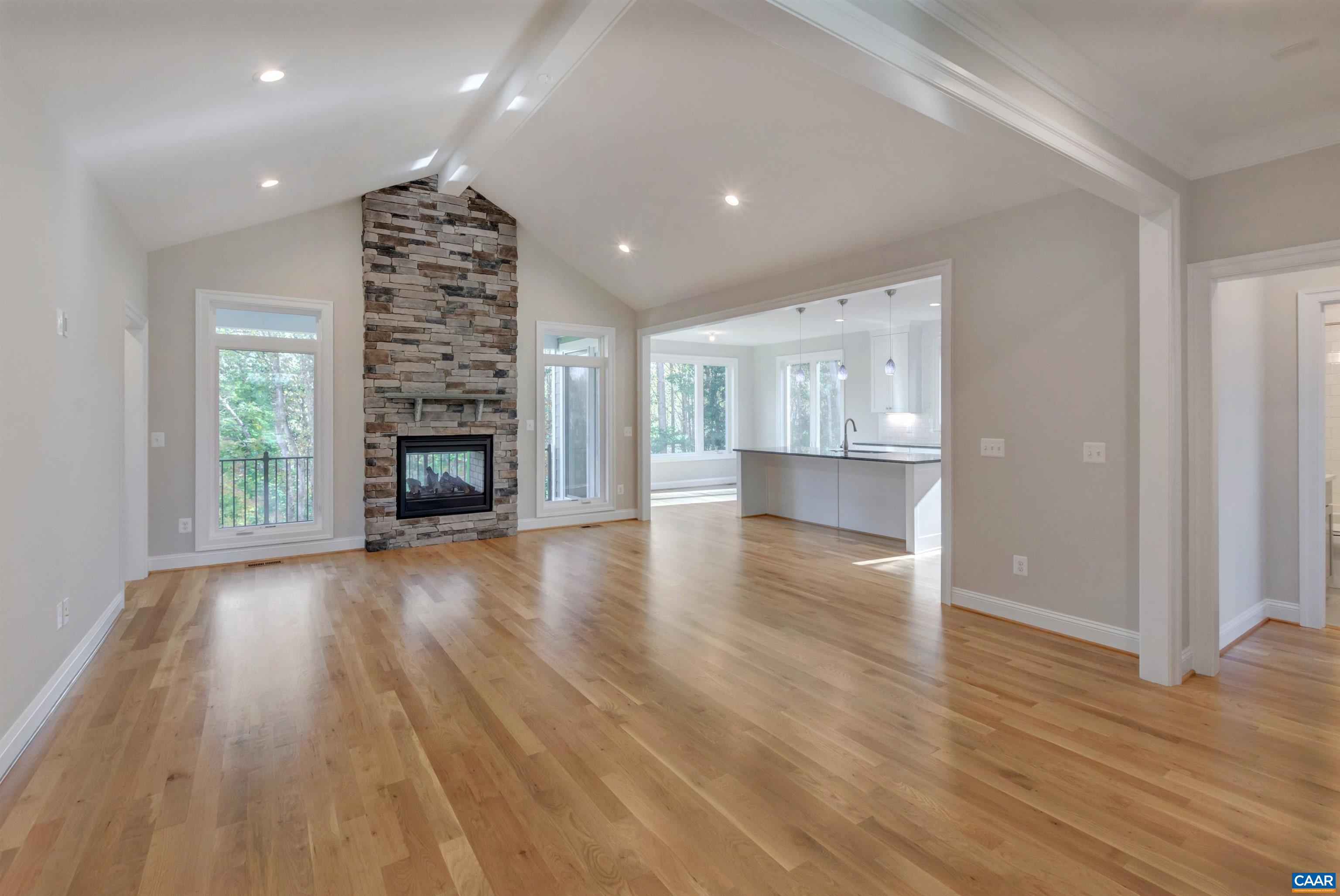 2519 Huntington Road Charlottesville, VA 22901 - Photo 13 of 47 an empty room with wooden floor fireplace and windows