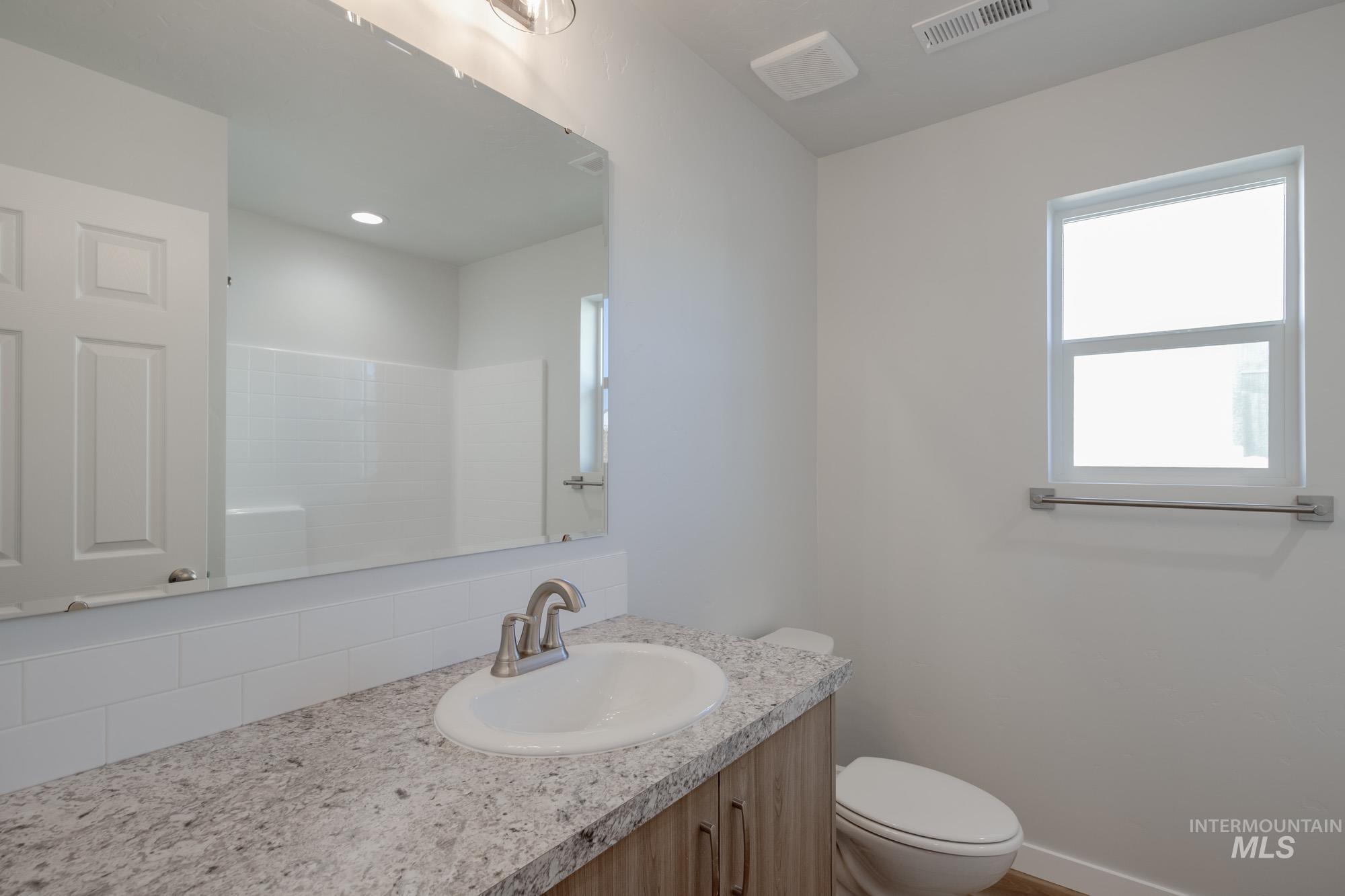 13723 Nisene Street Caldwell, ID 83607 - Photo 15 of 22 Full bathroom with vanity and a shower