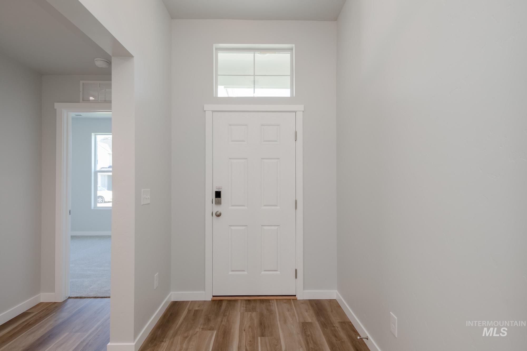 13723 Nisene Street Caldwell, ID 83607 - Photo 2 of 22 Foyer entrance featuring light wood-style flooring and baseboards
