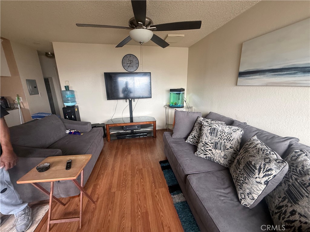 8634 Park, Unit 3 Bellflower, CA 90706 - Photo 11 of 12 a living room with furniture and a wooden floor