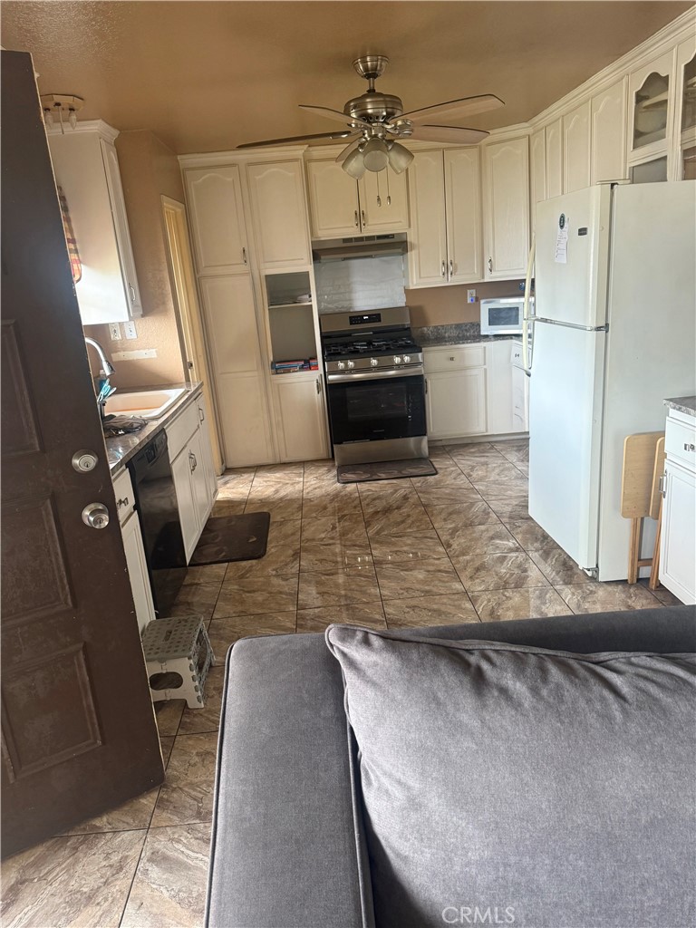 8634 Park, Unit 3 Bellflower, CA 90706 - Photo 12 of 12 a kitchen with refrigerator and window